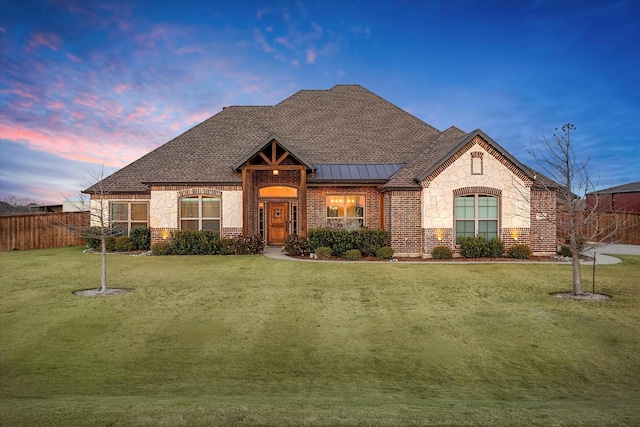 view of front of home featuring a lawn