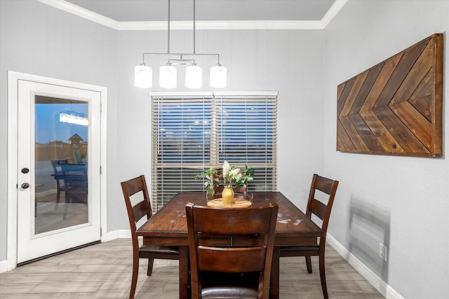 dining space featuring ornamental molding and light wood-type flooring