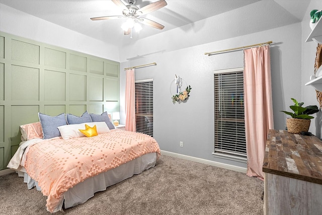 bedroom featuring ceiling fan and carpet