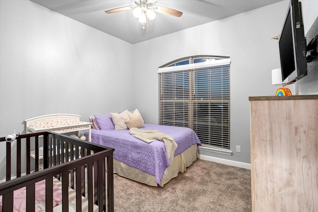 bedroom with ceiling fan and carpet flooring