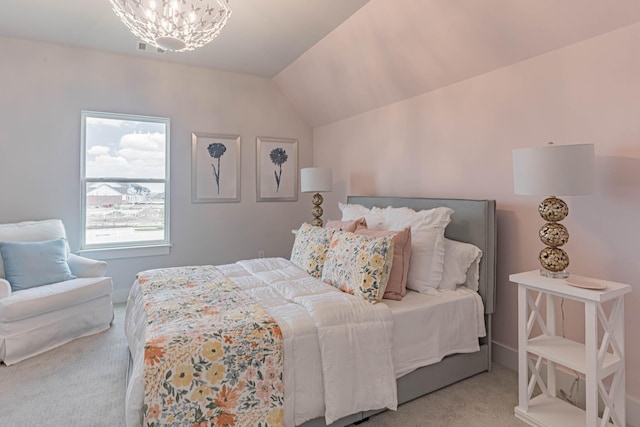 bedroom featuring a notable chandelier, vaulted ceiling, and carpet