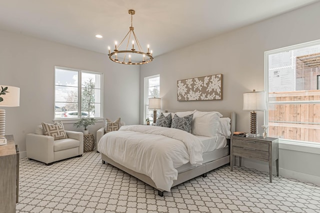 bedroom with a notable chandelier