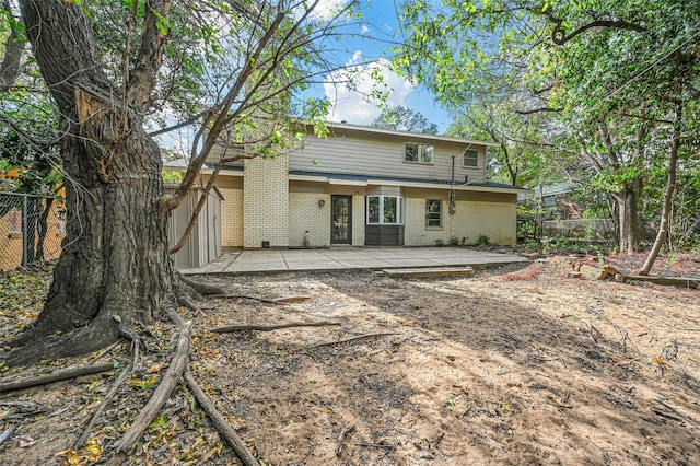 back of property featuring a patio