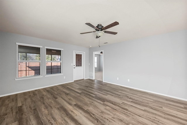 empty room with wood-type flooring and ceiling fan