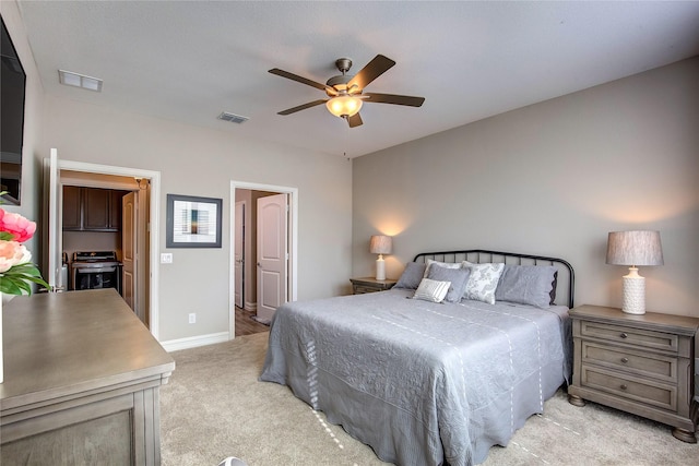 bedroom with light carpet, baseboards, a ceiling fan, and visible vents