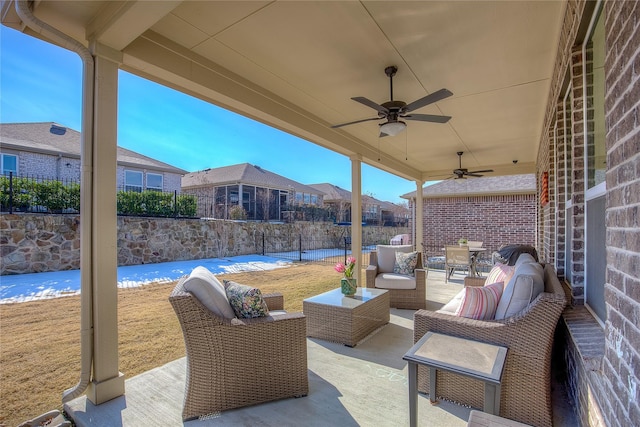 view of patio with a fenced backyard, outdoor lounge area, and ceiling fan