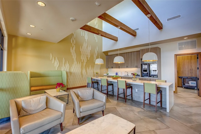 living room featuring high vaulted ceiling and beam ceiling