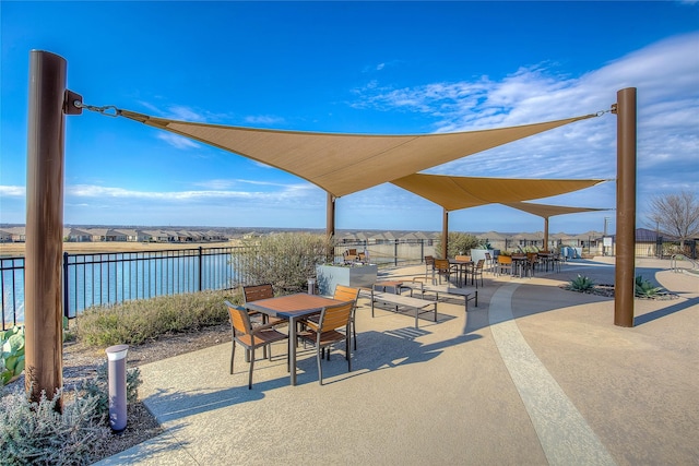 view of patio with a water view