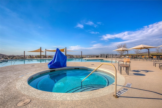 view of pool with a community hot tub