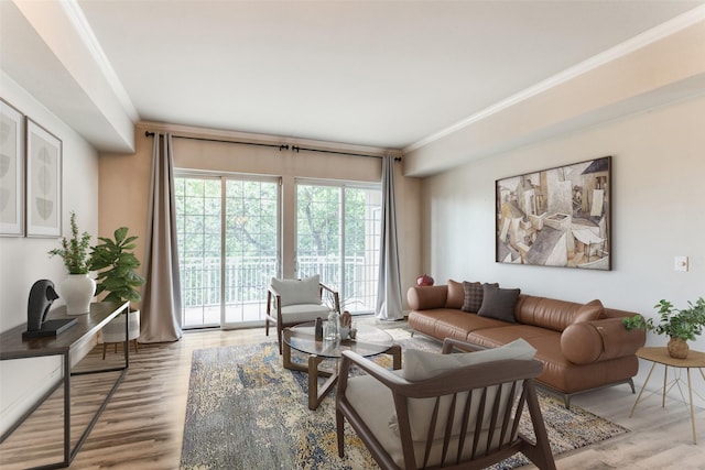 living room featuring ornamental molding and wood-type flooring