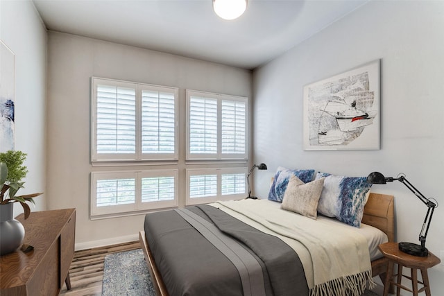 bedroom with hardwood / wood-style floors