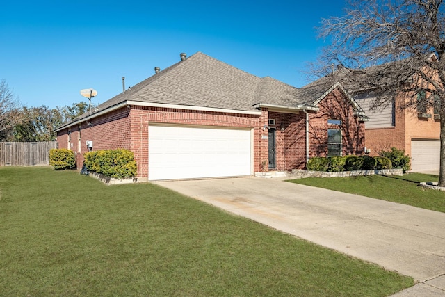 view of front facade with a garage and a front yard