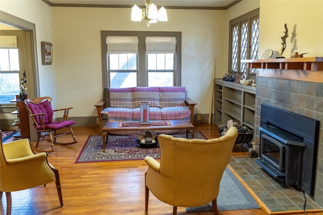 living area featuring a notable chandelier, a wealth of natural light, and hardwood / wood-style floors