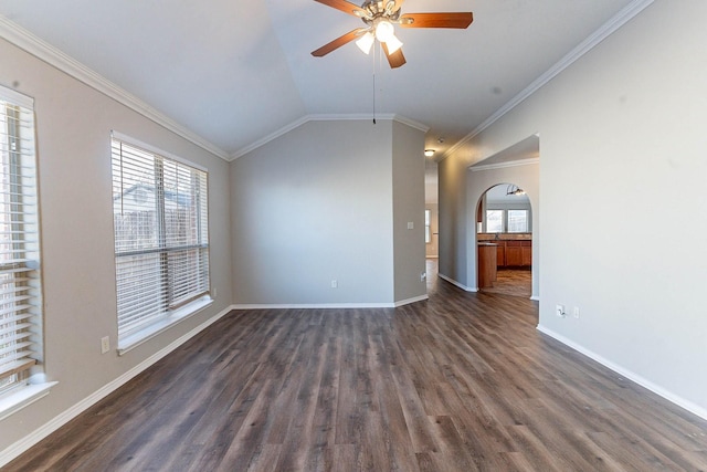 interior space with lofted ceiling, ornamental molding, ceiling fan, and dark hardwood / wood-style floors