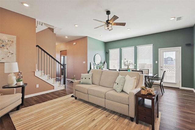 living room featuring ceiling fan and hardwood / wood-style floors