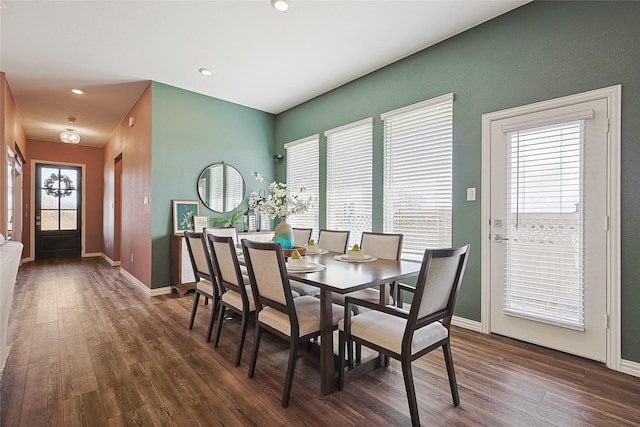 dining area with dark hardwood / wood-style flooring