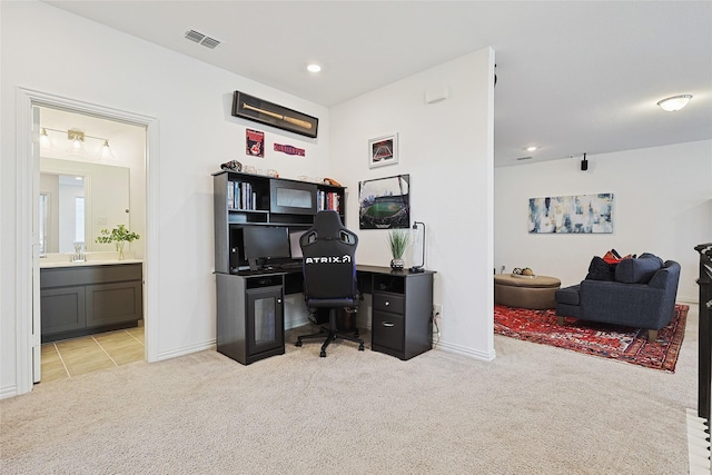 carpeted office with sink