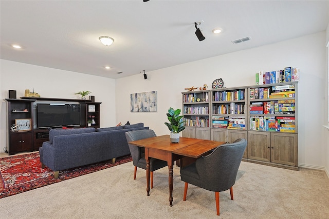 dining space with light carpet