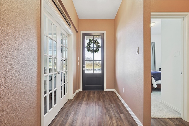 doorway to outside with french doors and dark hardwood / wood-style floors