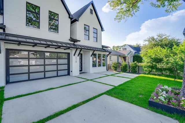 view of front facade with a front lawn and a garage