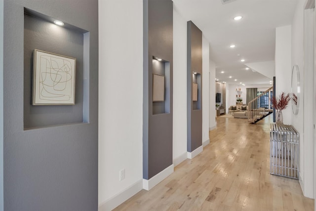 corridor featuring light hardwood / wood-style flooring