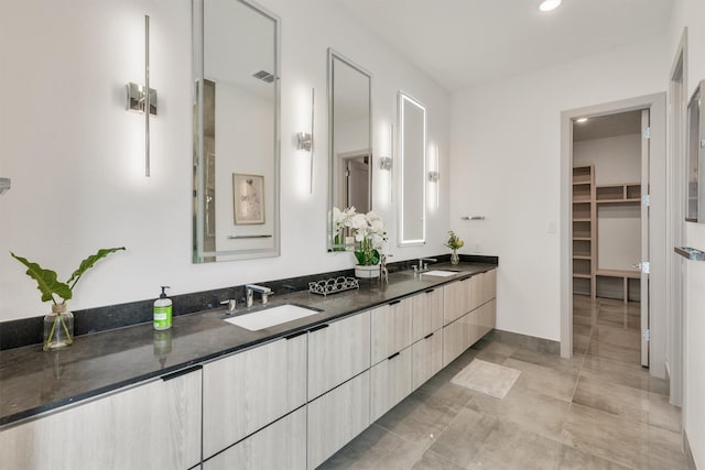 bathroom featuring tile patterned floors and vanity