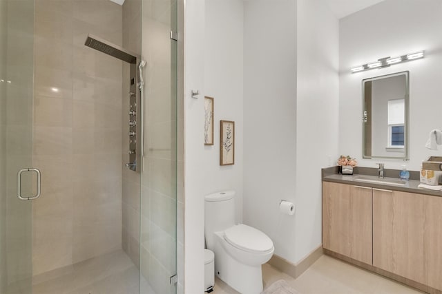 bathroom with toilet, an enclosed shower, tile patterned floors, and vanity