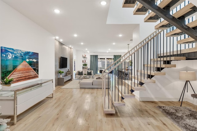 stairway featuring hardwood / wood-style floors