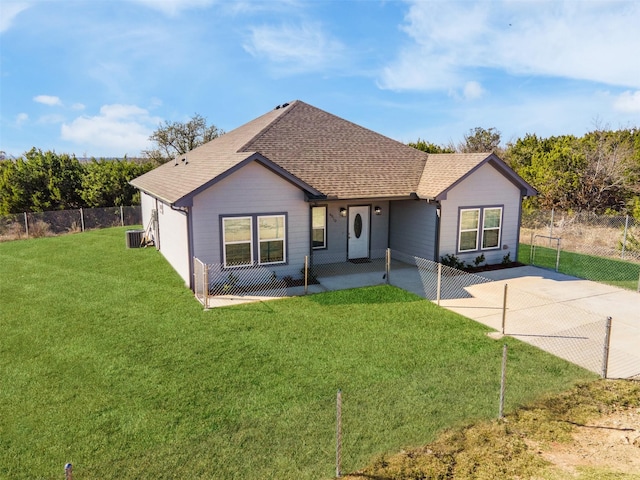 ranch-style house featuring a front yard and central AC