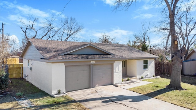 single story home with a front lawn and a garage