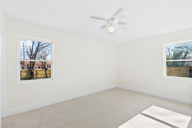 carpeted empty room with ceiling fan