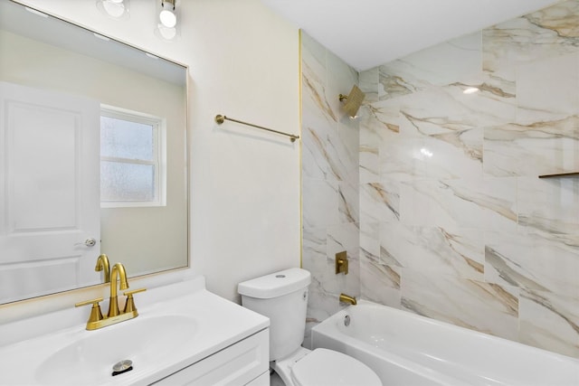 full bathroom featuring tiled shower / bath, vanity, and toilet