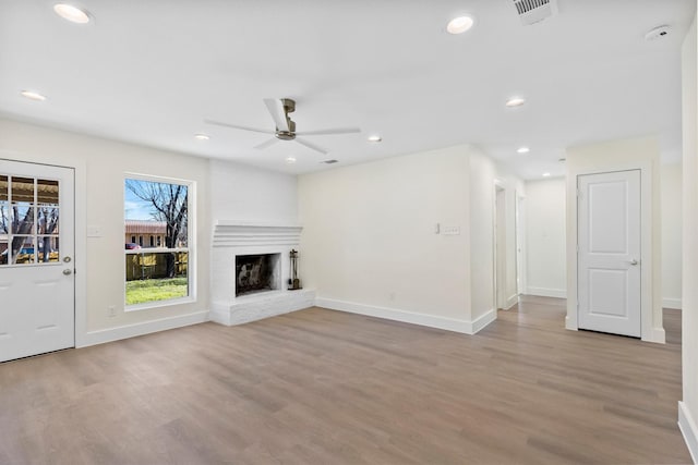 3506 Mcdonald Way, Garland, TX 75041 - unfurnished living room featuring wood finished floors, a ceiling fan, baseboards, a fireplace, and recessed lighting