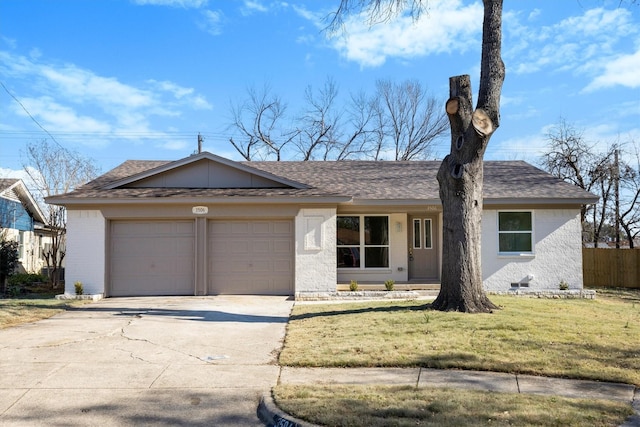 ranch-style house featuring a front lawn and a garage