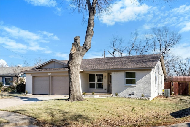 ranch-style home featuring a front lawn, central AC unit, and a garage