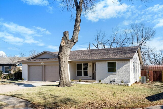 3506 Mcdonald Way, Garland, TX 75041 - ranch-style home with a garage, central AC unit, concrete driveway, a shingled roof, and brick siding