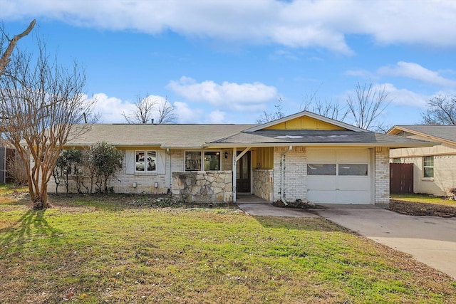 ranch-style house with a carport, a front yard, and a garage