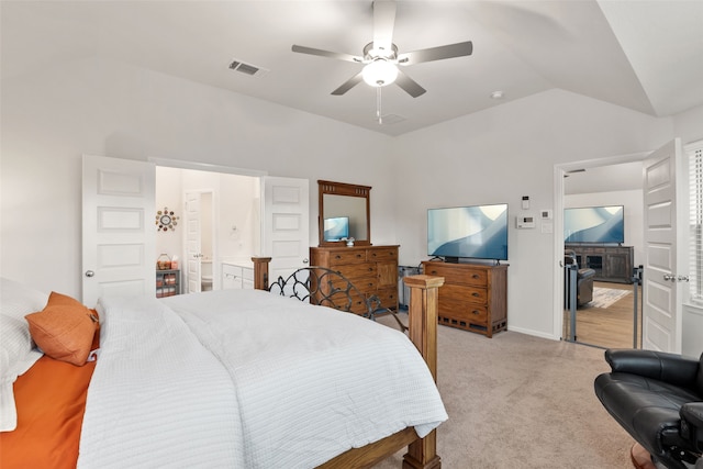 bedroom featuring ceiling fan, light carpet, visible vents, baseboards, and vaulted ceiling