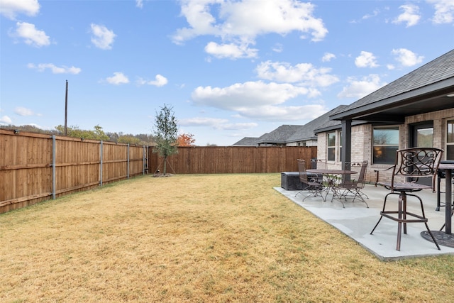 view of yard featuring a patio area and a fenced backyard