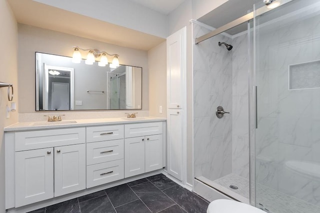 bathroom with a shower with door and vanity