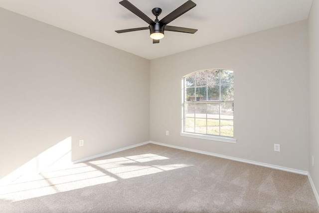 empty room with light carpet and ceiling fan