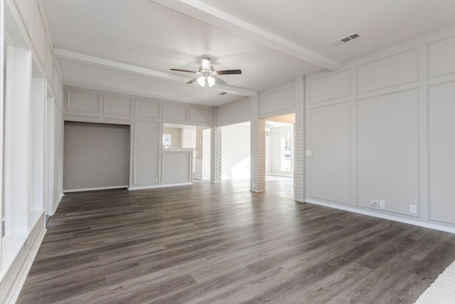 interior space with dark hardwood / wood-style flooring, ceiling fan, and beam ceiling