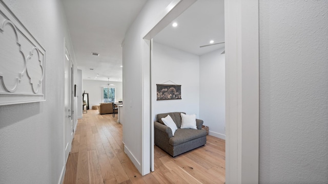 hallway with light wood-type flooring