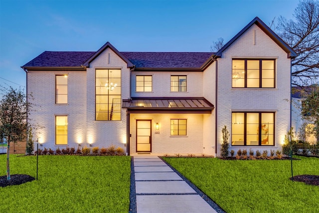 view of front of home with a yard