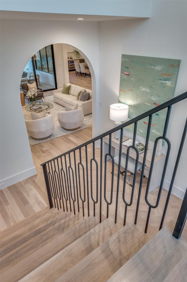 stairway with wood-type flooring