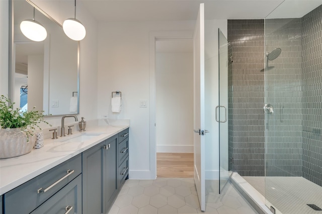 bathroom with vanity, tile patterned floors, and a shower with shower door