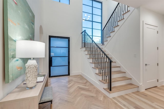 entryway featuring a high ceiling and plenty of natural light