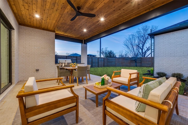 view of patio with a grill, ceiling fan, and an outdoor living space