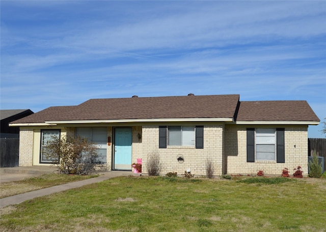 ranch-style home with a front yard