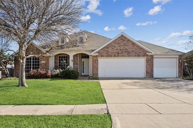 view of front of house with a front lawn and a garage